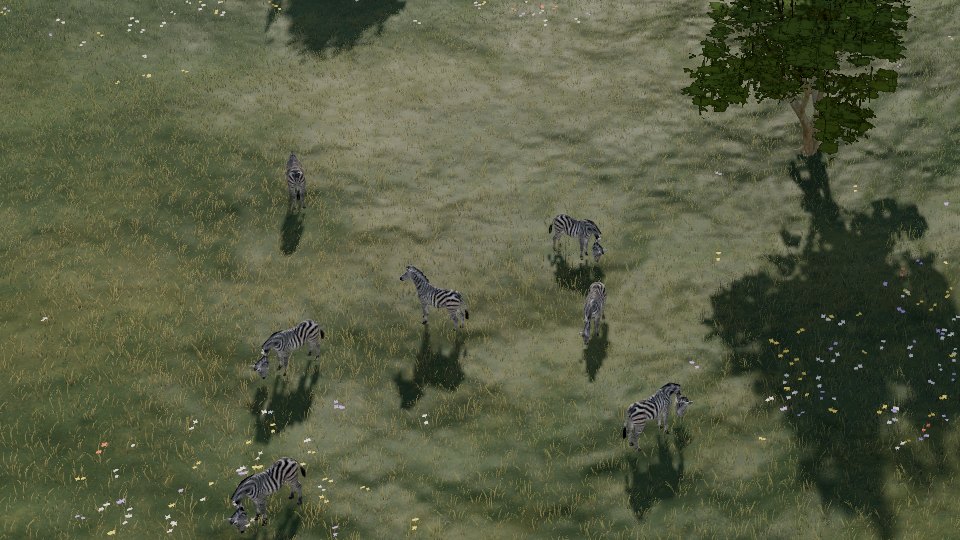 A herd of zebra grazing among the trees